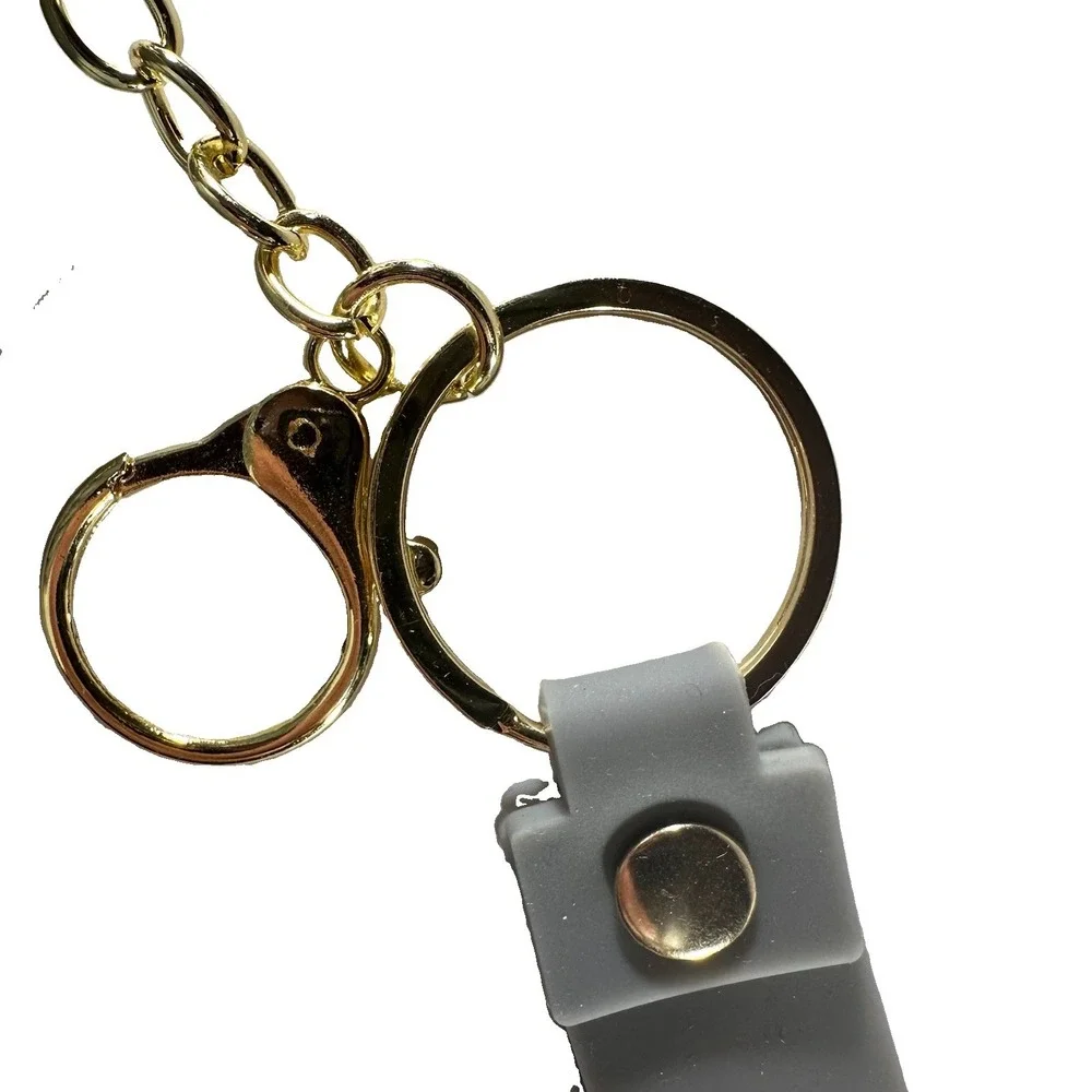 Grey & white miniature Nike Keychain styled like an Air Jordan wrist strap/bag
